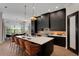 Modern kitchen with a large island and seating, open to the dining area at 2645 Delphi Hills Ct, Lakeland, FL 33812