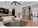 Bright living room featuring a modern wine closet and open floor plan at 2645 Delphi Hills Ct, Lakeland, FL 33812