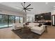 Open living area with pool access and contemporary furnishings at 2645 Delphi Hills Ct, Lakeland, FL 33812