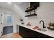 Chic wet bar with cat-themed wallpaper, floating shelves, and quartz countertop at 2645 Delphi Hills Ct, Lakeland, FL 33812