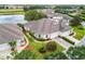 Aerial view of a lovely home near a tranquil lake and lush greenery at 2820 Prestwick Dr, Lakeland, FL 33803