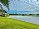 Expansive view of the lake and golf course from the property's well-manicured backyard at 2820 Prestwick Dr, Lakeland, FL 33803