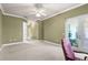 Spacious bedroom featuring neutral carpet and a glass door at 2820 Prestwick Dr, Lakeland, FL 33803
