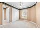 Bedroom featuring a ceiling fan, window with blinds and carpeted flooring at 2820 Prestwick Dr, Lakeland, FL 33803