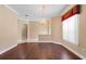 Dining area with a chandelier, chair railing, hard wood floors and access to other rooms at 2820 Prestwick Dr, Lakeland, FL 33803