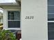Exterior view of the house number with a window and an AC unit partially visible at 2820 Prestwick Dr, Lakeland, FL 33803