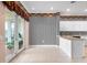 Eat-in kitchen with striped wallpaper, modern countertops, white cabinets, and sliding glass doors at 2820 Prestwick Dr, Lakeland, FL 33803