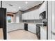 Kitchen with white cabinets, an island, and black appliances at 2820 Prestwick Dr, Lakeland, FL 33803