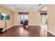 Living room with hardwood floors, ceiling fan, and sliding glass doors to outside at 2820 Prestwick Dr, Lakeland, FL 33803