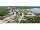 Scenic aerial view of a residential community with lush greenery, waterfront views, and well-maintained homes at 3187 Bellflower Way, Lakeland, FL 33811