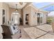 Outdoor back porch with brick flooring, comfortable seating, and view of the backyard at 3187 Bellflower Way, Lakeland, FL 33811