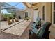 Back patio perfect for relaxing, with ceiling fans, brick floors and comfortable seating at 3187 Bellflower Way, Lakeland, FL 33811