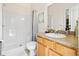 Bathroom featuring single sink vanity, toilet and step in shower at 3187 Bellflower Way, Lakeland, FL 33811