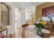 Charming dining area adjacent to the kitchen, featuring a stylish chandelier and wood-look tile at 3187 Bellflower Way, Lakeland, FL 33811