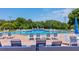 Inviting community pool featuring lounge chairs and clear blue water, perfect for relaxation at 3187 Bellflower Way, Lakeland, FL 33811