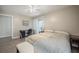 Comfortable bedroom with light walls, laminate floors, a bed, and access to the outdoors at 319 Shadow Moss Ct # 319, Lakeland, FL 33813