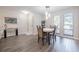 Dining area featuring modern lighting and hardwood floors at 319 Shadow Moss Ct # 319, Lakeland, FL 33813