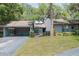 Charming home featuring a well-manicured front yard and attached garage at 319 Shadow Moss Ct # 319, Lakeland, FL 33813