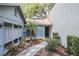 Landscaped front entrance with decorative plantings at 319 Shadow Moss Ct # 319, Lakeland, FL 33813