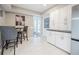 Inviting breakfast area features a high-top table with chairs and a view into the front of the home at 319 Shadow Moss Ct # 319, Lakeland, FL 33813