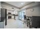 Modern kitchen featuring stainless steel appliances, white cabinetry, and an adjacent dining area at 319 Shadow Moss Ct # 319, Lakeland, FL 33813