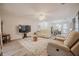 Spacious living room with hardwood floors and contemporary furniture at 319 Shadow Moss Ct # 319, Lakeland, FL 33813