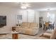 Bright living room with hardwood floors, lots of light, and contemporary furniture at 319 Shadow Moss Ct # 319, Lakeland, FL 33813