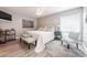 Serene main bedroom featuring soft natural light, a decorative accent rug, and ample space for a sitting area at 319 Shadow Moss Ct # 319, Lakeland, FL 33813