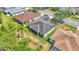 Bird's eye view of home's backyard, with screened in porch and mature trees providing shade at 3252 Bellflower Way, Lakeland, FL 33811
