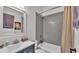 Updated bathroom with tub-shower combo and gray tile walls at 3252 Bellflower Way, Lakeland, FL 33811