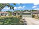 Inviting home with a two-car garage, manicured lawn, and stylish exterior at 3252 Bellflower Way, Lakeland, FL 33811
