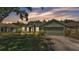 Charming single-story home with a manicured lawn and mature landscaping enhancing its curb appeal at 3252 Bellflower Way, Lakeland, FL 33811