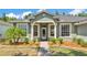 Beautiful home entrance, showcasing a well-maintained lawn and mature landscaping at 3252 Bellflower Way, Lakeland, FL 33811
