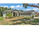 Charming home featuring lush landscaping, a well-manicured lawn, and beautiful curb appeal at 3252 Bellflower Way, Lakeland, FL 33811