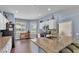 Well-lit kitchen featuring granite countertops, lots of storage, and contemporary fixtures at 3252 Bellflower Way, Lakeland, FL 33811