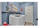 Functional laundry room featuring a modern washer and dryer and ample space at 3252 Bellflower Way, Lakeland, FL 33811