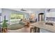 Open-concept living room with lots of natural light and a seamless transition to outdoor screened porch at 3252 Bellflower Way, Lakeland, FL 33811