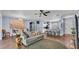 Open-concept living area with view of dining room, kitchen and comfortable seating at 3252 Bellflower Way, Lakeland, FL 33811
