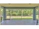 Large screened patio with view of the backyard at 3252 Bellflower Way, Lakeland, FL 33811