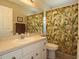 Well-lit bathroom showcasing a vanity with a large mirror and shower at 3359 Sanoma Dr, Lakeland, FL 33811