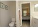 Toilet area leading to a view of the bedroom and bathroom, showcasing natural light at 3359 Sanoma Dr, Lakeland, FL 33811