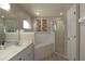 Bathroom featuring a sink vanity, a shower with glass door, and a separate tub at 3359 Sanoma Dr, Lakeland, FL 33811