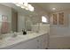 Bathroom featuring a double vanity, a separate bathtub, and a glass-enclosed shower at 3359 Sanoma Dr, Lakeland, FL 33811