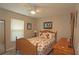 Cozy bedroom features a charming wicker bed frame and a ceiling fan at 3359 Sanoma Dr, Lakeland, FL 33811