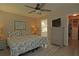 Relaxing bedroom with ceiling fan, walk-in closet, an ensuite bathroom, and wood look flooring at 3359 Sanoma Dr, Lakeland, FL 33811