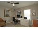 Bedroom features a ceiling fan, desk, and comfortable seating area at 3359 Sanoma Dr, Lakeland, FL 33811