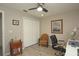 Bedroom with an office area featuring a double door closet and ceiling fan at 3359 Sanoma Dr, Lakeland, FL 33811