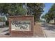Community entrance sign with brick and manicured landscaping at 3359 Sanoma Dr, Lakeland, FL 33811