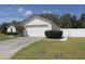 Spacious two-car garage adjacent to a beautifully landscaped front yard at 3359 Sanoma Dr, Lakeland, FL 33811