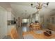 Bright kitchen featuring white cabinets, modern appliances, wood look flooring, and an eat-in breakfast bar at 3359 Sanoma Dr, Lakeland, FL 33811